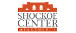 Logo of Shockoe Center Apartments featuring a stylized building silhouette in orange.