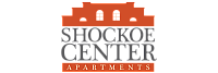 Elegant logo of Shockoe Center Apartments featuring a stylized building silhouette.
