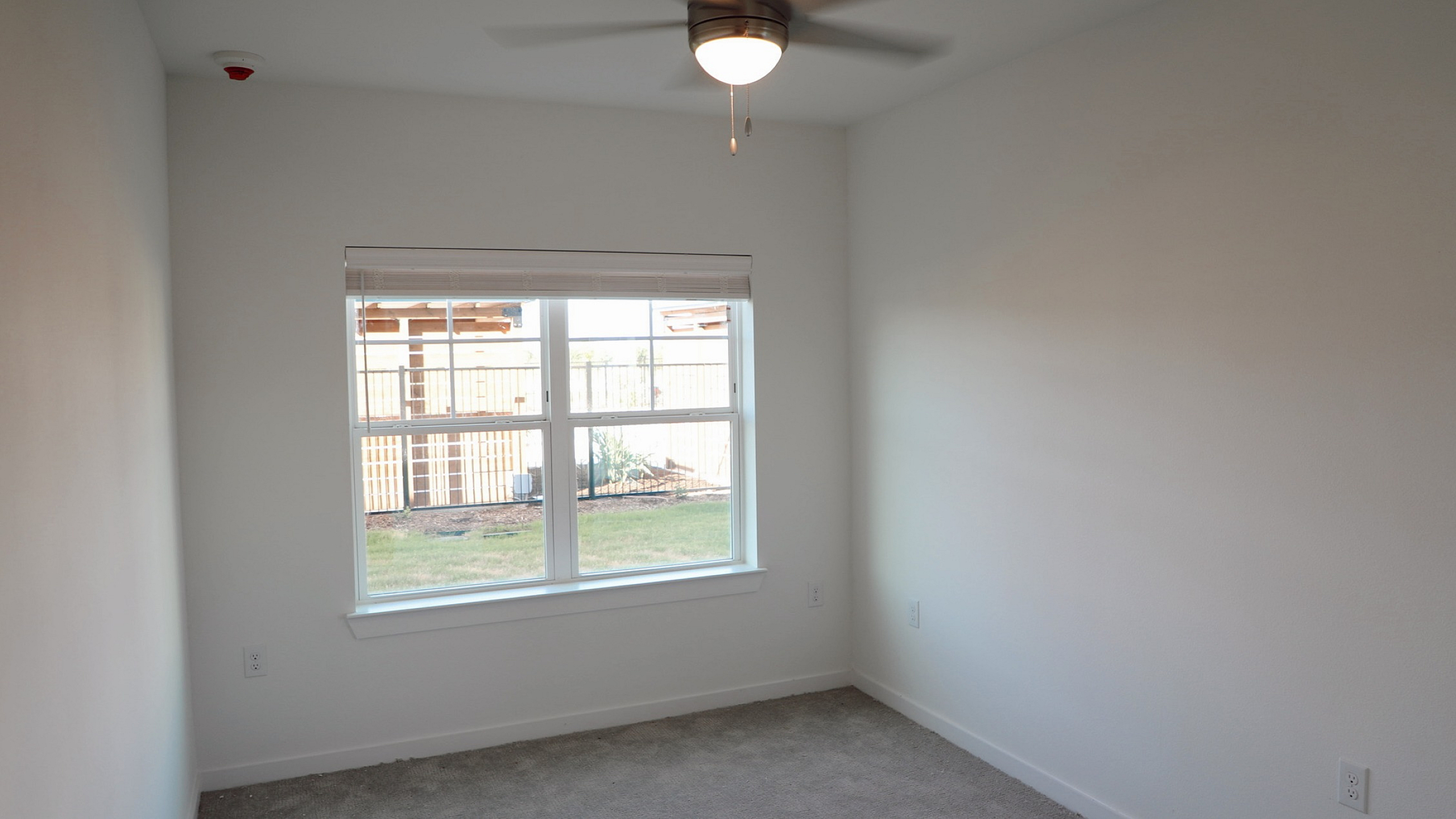 Luxurious apartment complex featuring a sparkling pool with lounge chairs, inflatables, and a vibrant social atmosphere.
