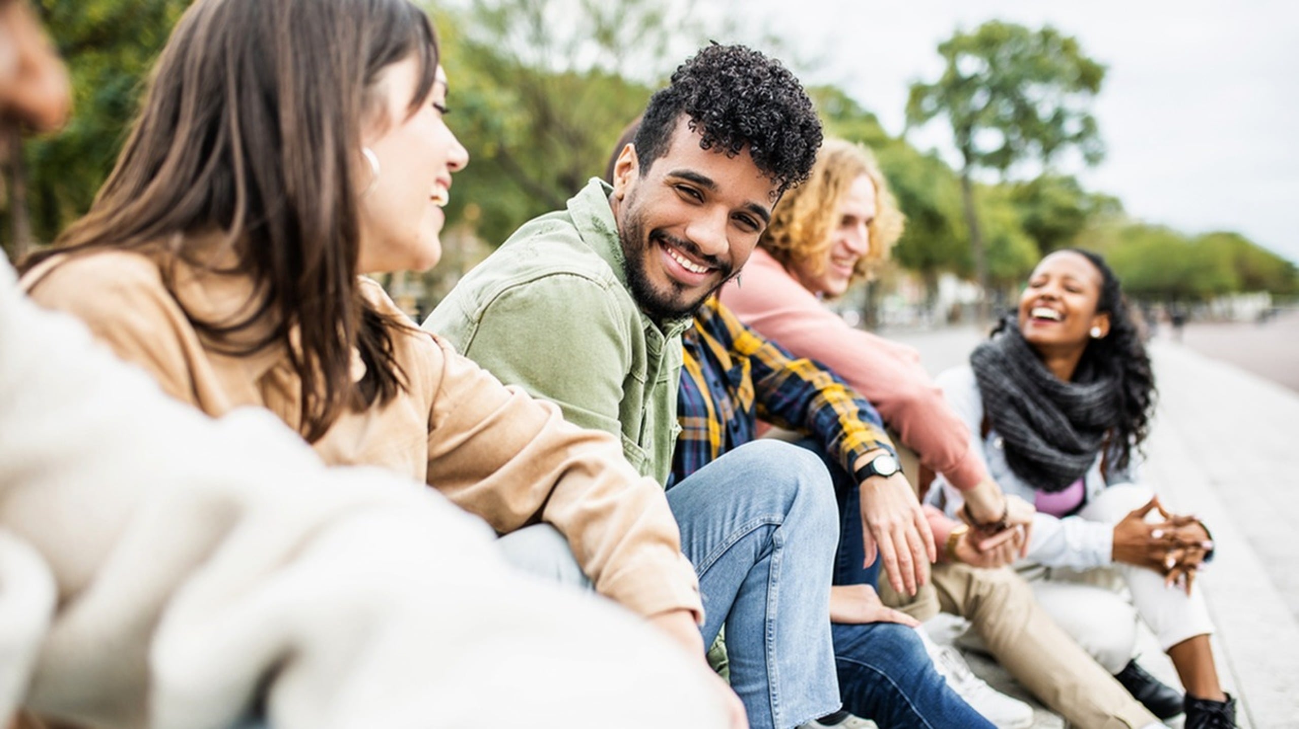 Friend group sitting and laughing
