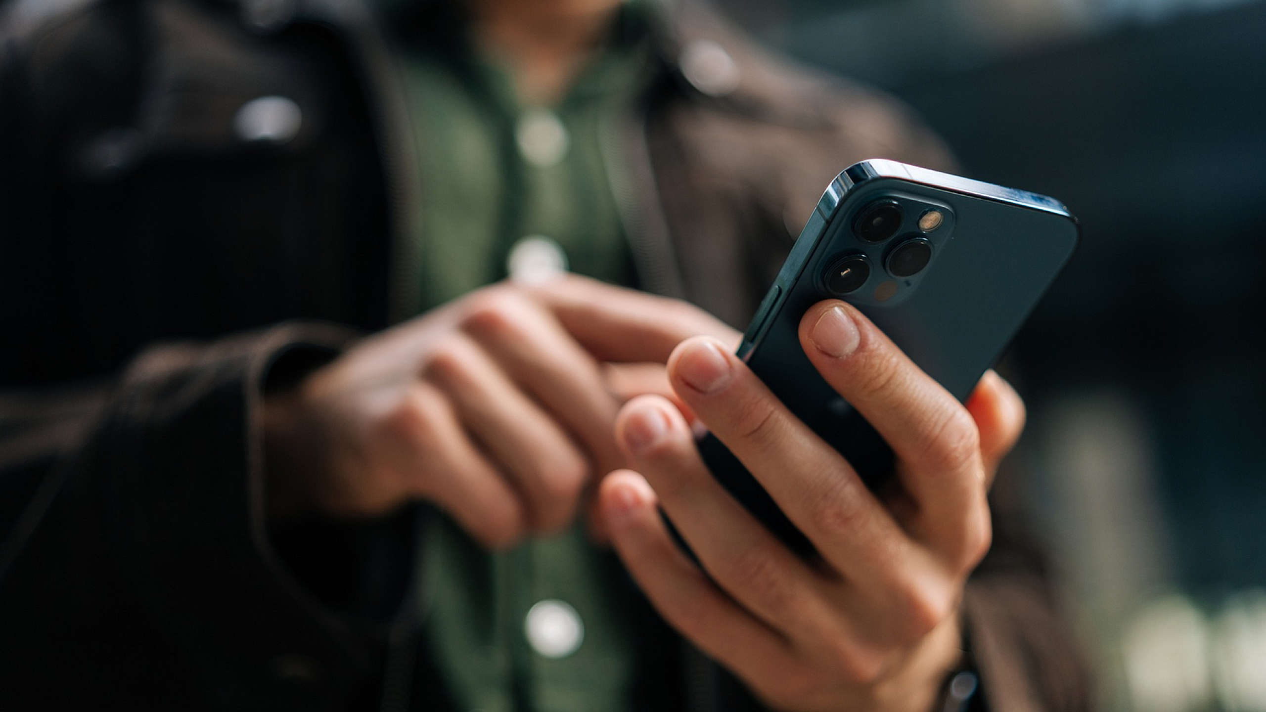 Close-up of a person using a smartphone, showcasing sleek design and modern technology.