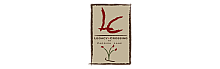 Elegant sign for Legacy Crossing at Parrish Lane with artistic red accents and floral design.