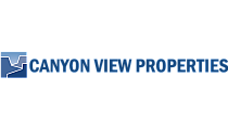 Logo for Canyon View Properties, featuring a modern mountain-like design in blue.