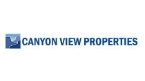 Elegant Canyon View Properties logo featuring a stylized canyon design in blue, representing premium real estate offerings.