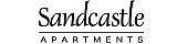 Elegant black and white logo for Sandcastle Apartments, featuring a castle silhouette within a whimsical cloud design.