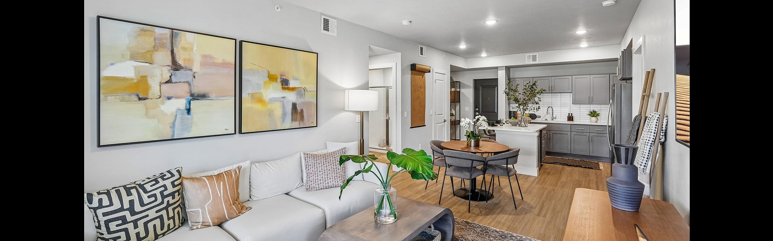 Bright modern living space with elegant decor, open-concept layout, and a stylish kitchen.