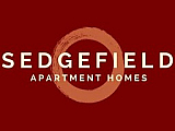 Sedgefield logo on a lush green background, evoking a sense of tranquility and community living.