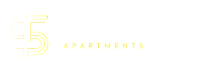 Modern logo for Tracks at Seymour Apartments, featuring sleek typography and a stylish design.