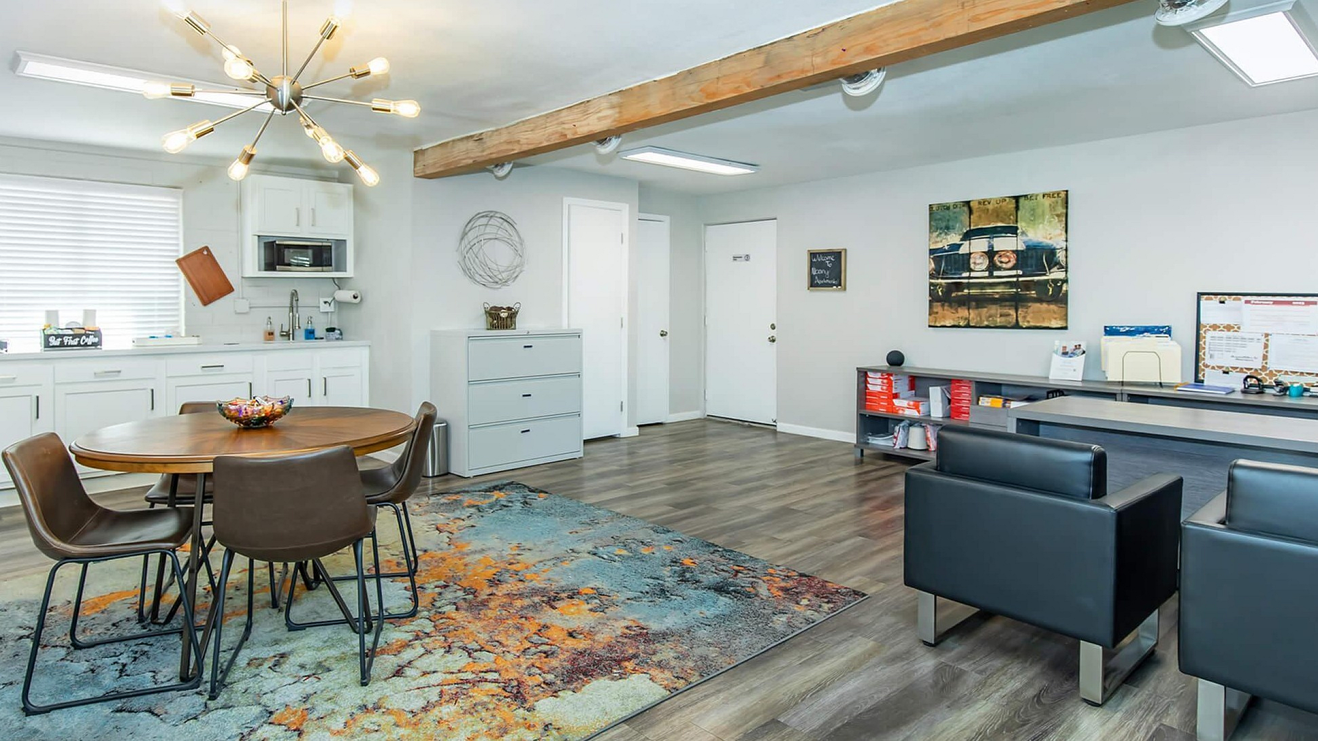 Modern open-plan living space with stylish dining area, sleek kitchen, and vibrant decor.