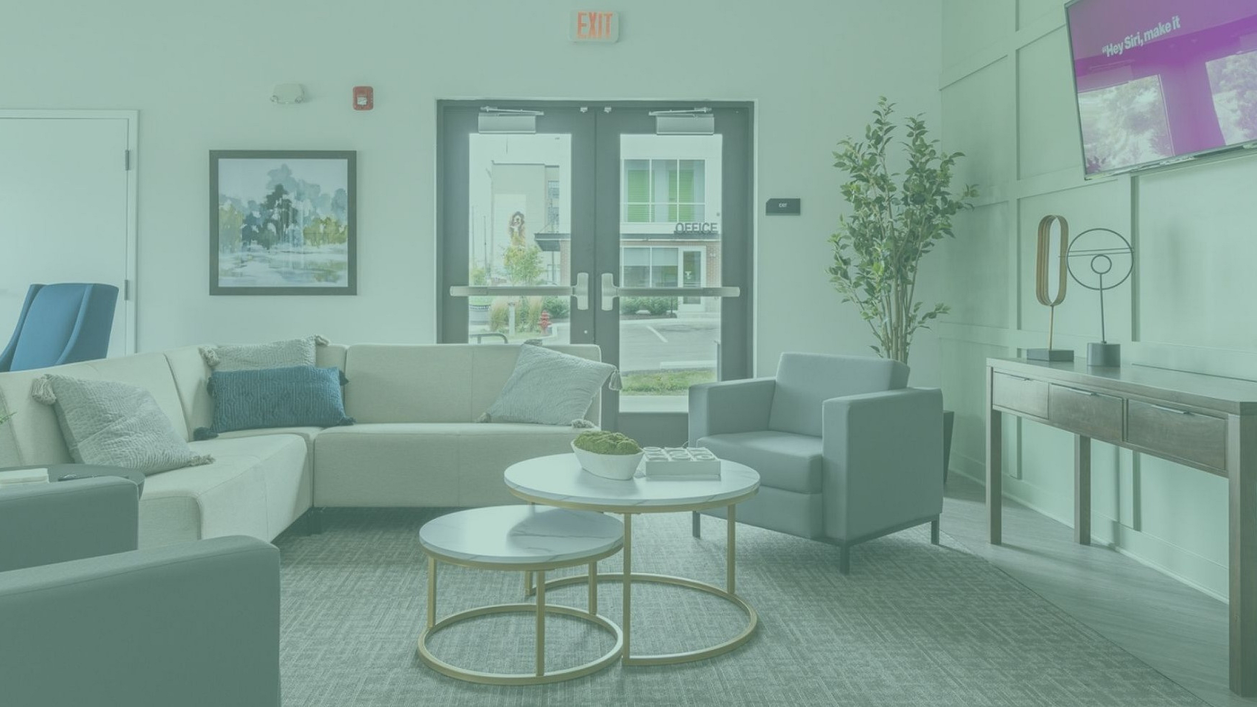 Inviting apartment lounge featuring a modern sofa set, stylish coffee tables, and a chic decor, perfect for relaxation and socializing.