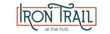 Elegant Iron Trail logo with artistic typography and stylish embellishments, perfect for modern living spaces.