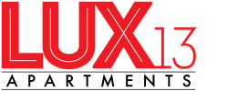 Bold red text logo featuring 'LUX13', showcasing a modern and stylish apartment branding.