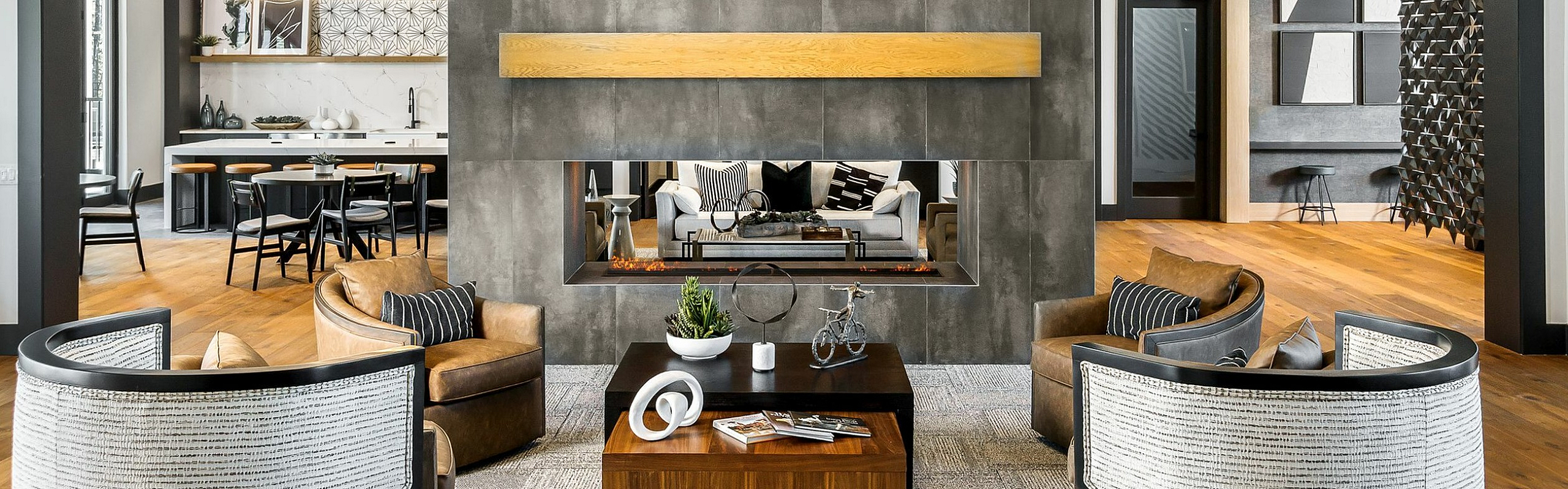 Luxurious living room with modern design, elegant seating, artistic chandelier, and stylish decor elements.