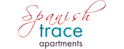 Elegant Spanish Trace Apartments logo with graceful script and modern typography.