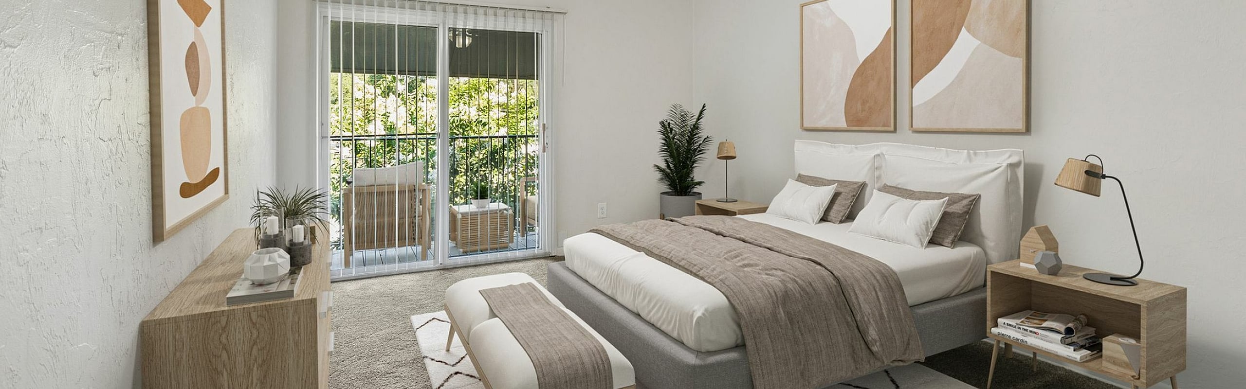 Serene bedroom with elegant decor, featuring a large bed, chic artwork, and a private balcony view.
