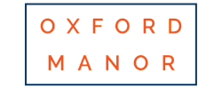 Elegant Oxford Manor logo with bold orange lettering on a sleek white background.