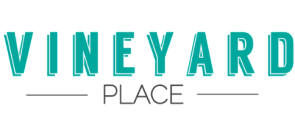 Modern logo for Vineyard Place featuring bold, turquoise lettering with a sleek design.