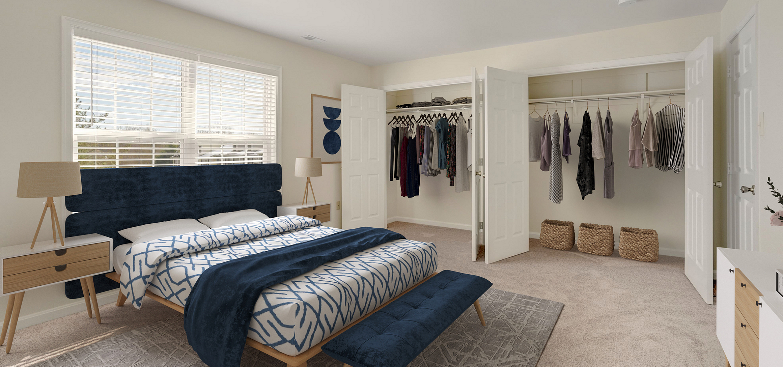 Elegant bedroom with plush carpet, stylish navy and white bed set, spacious open closet, and modern bedside tables for a cozy, luxurious space.