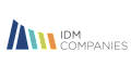 IDM Companies logo with sleek, colorful geometric design.