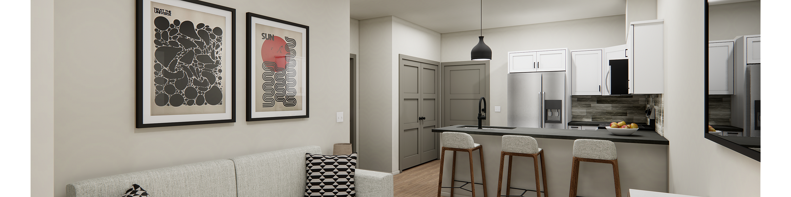 Modern living space with a cozy sofa, abstract artwork, and an open kitchen featuring sleek bar seating.