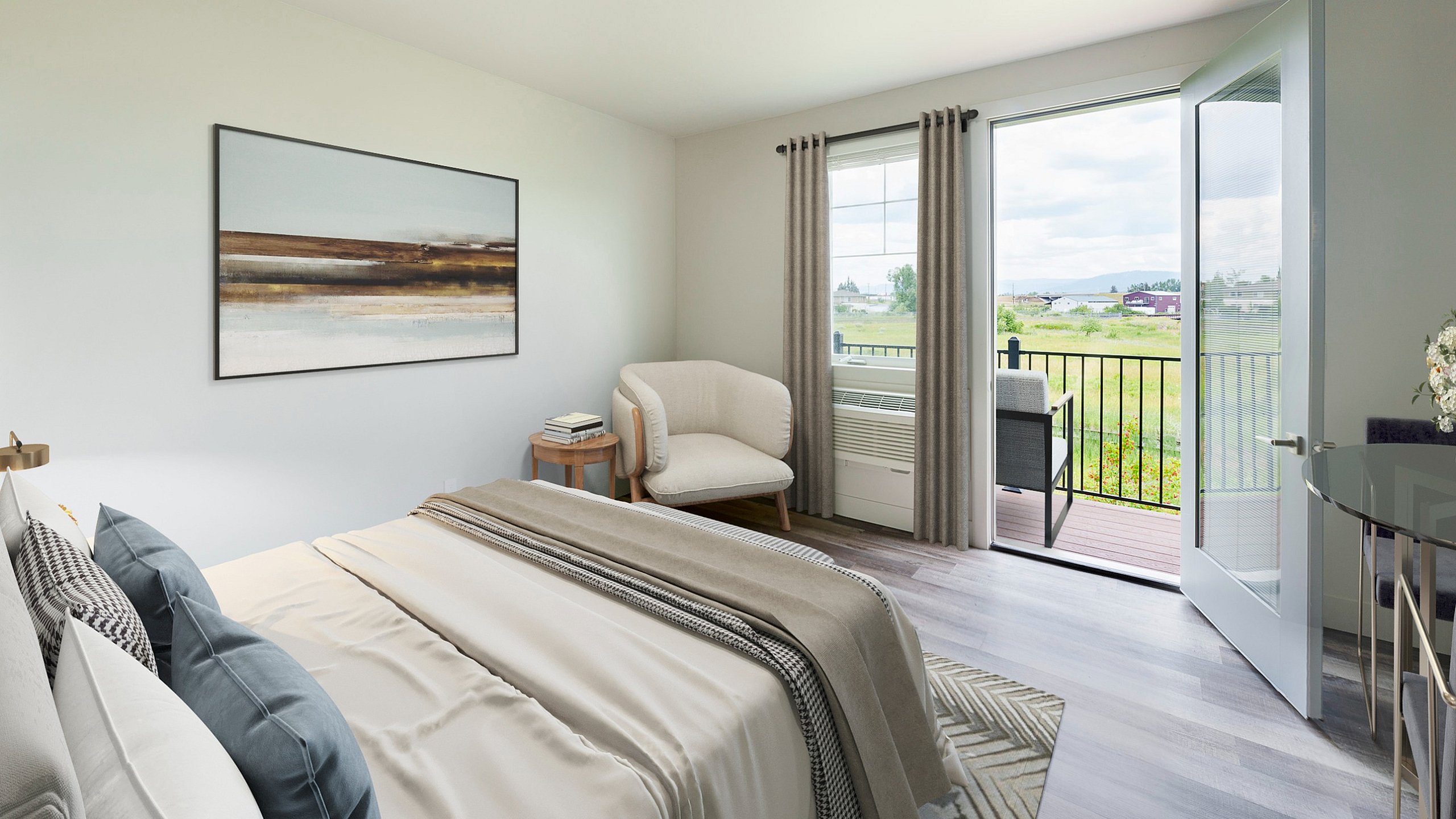 Bright and airy bedroom with modern decor, featuring large windows opening to a scenic view and cozy seating area.