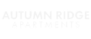 Autumn Ridge Apartments logo with bold white lettering on a transparent background, conveying modern elegance and style.