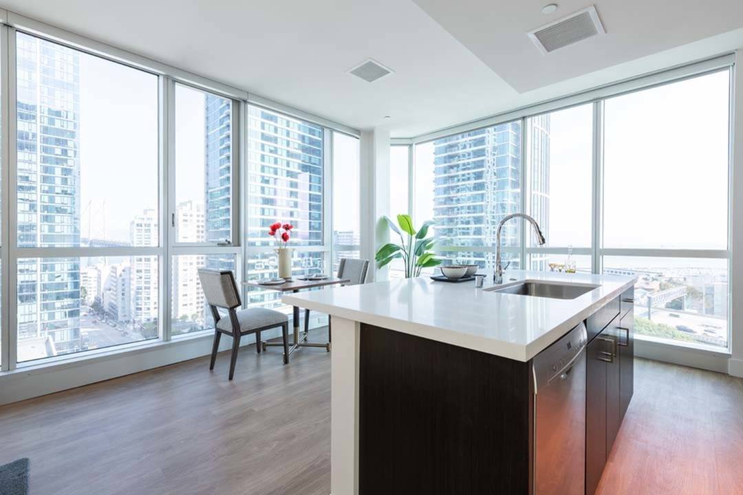 Chef\'s island faces floor-to-ceiling windows