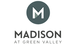 Sophisticated logo for Madison at Green Valley, featuring a bold 'M' within a sleek, modern circle.