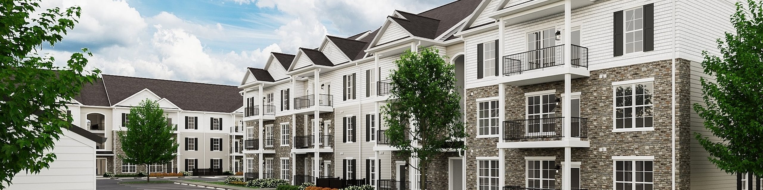 Elegant apartment complex with modern design, featuring spacious balconies and beautifully maintained landscaping. Ample parking and picturesque surroundings offer comfortable living.