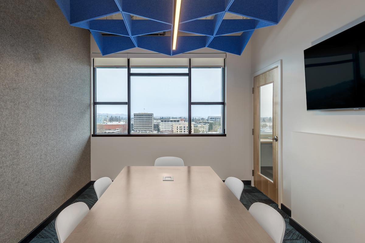Private study room with table, chairs, and a flat screen tv