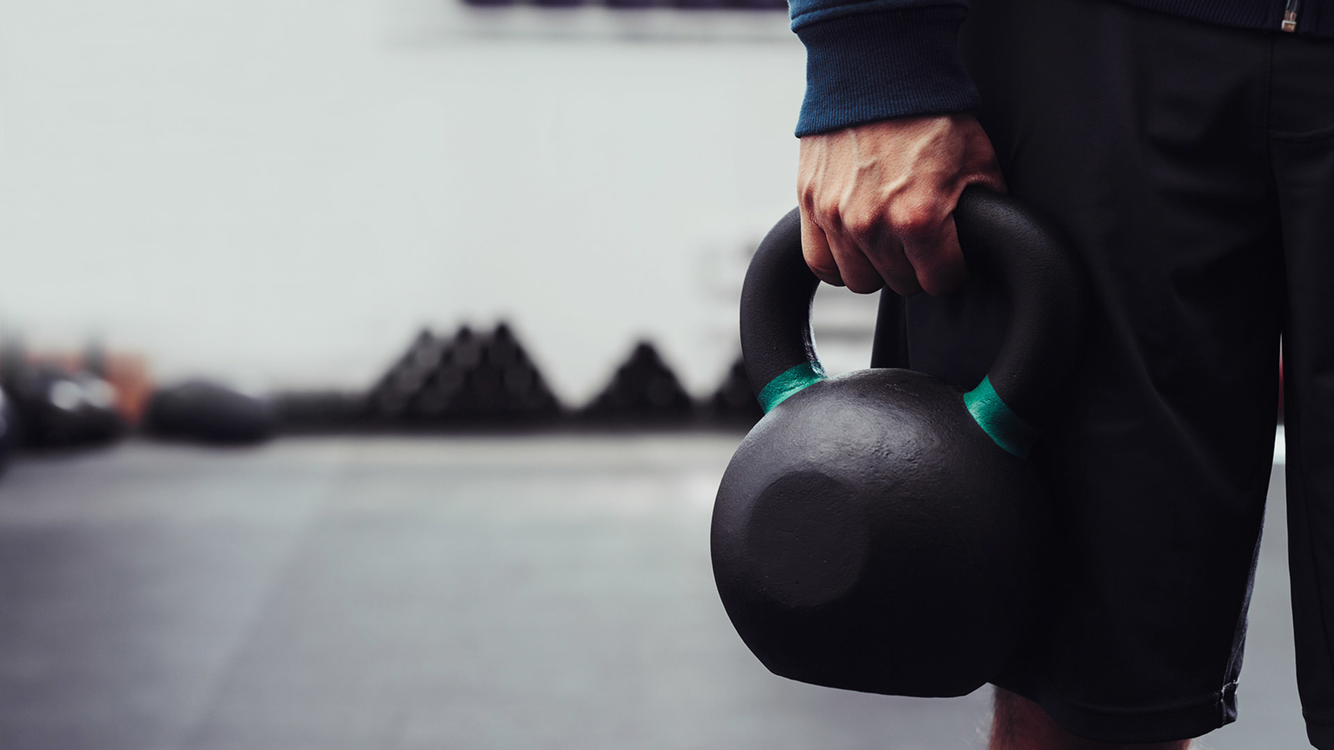person holding a kettle bell