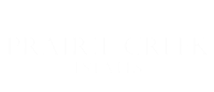 Prairie Creek Estates elegant logo in sophisticated white font on a transparent background.