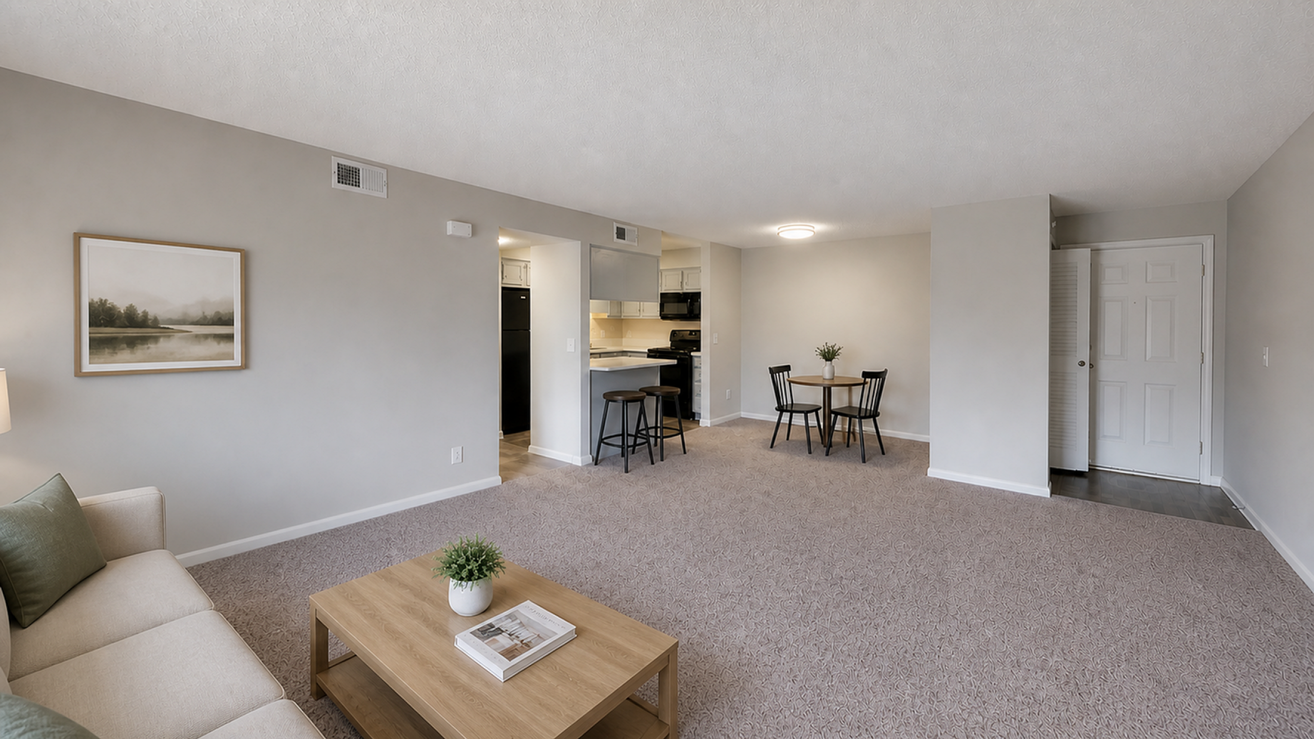 Inviting open-concept living space with cozy seating, modern kitchen, and stylish dining area.