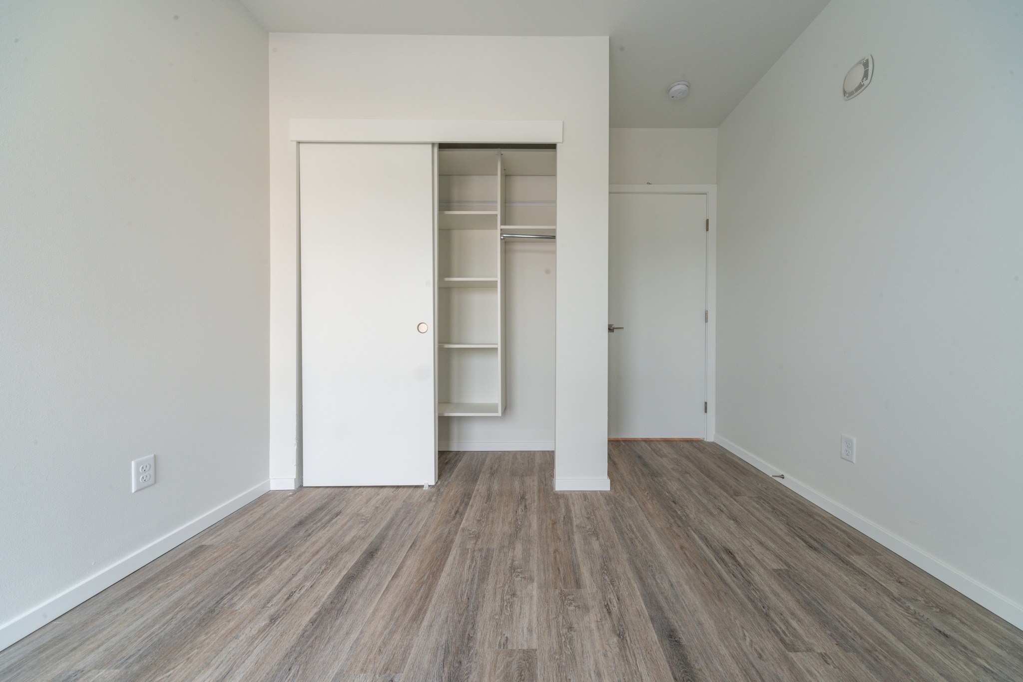 Bedroom with Closet Shelving Displayed