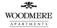 Elegant Woodmere Apartments logo with classic black font and decorative floral accent.