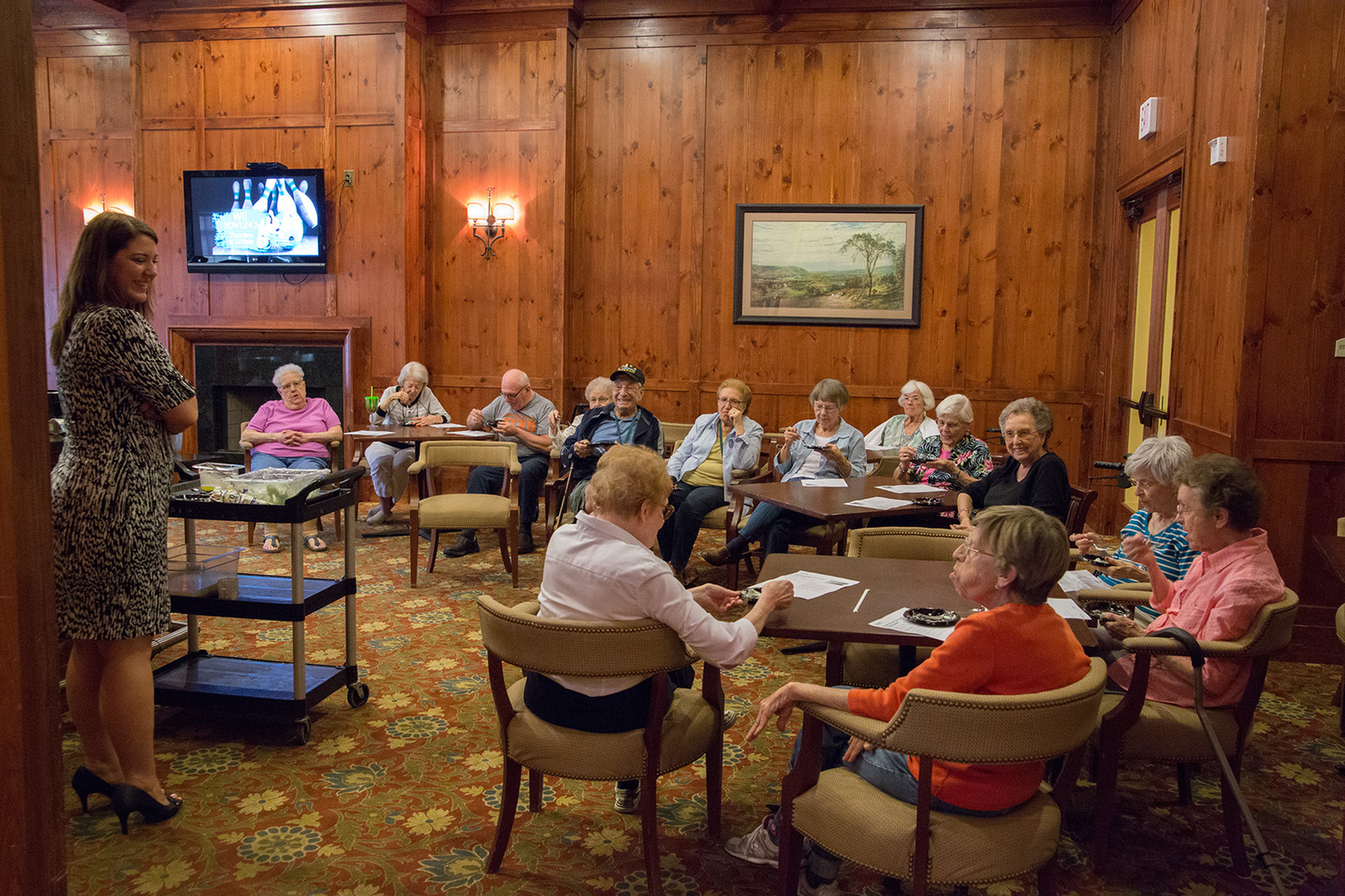 Residents gathered together in The Lodge at BridgeMill's community club room, enjoying a presentation