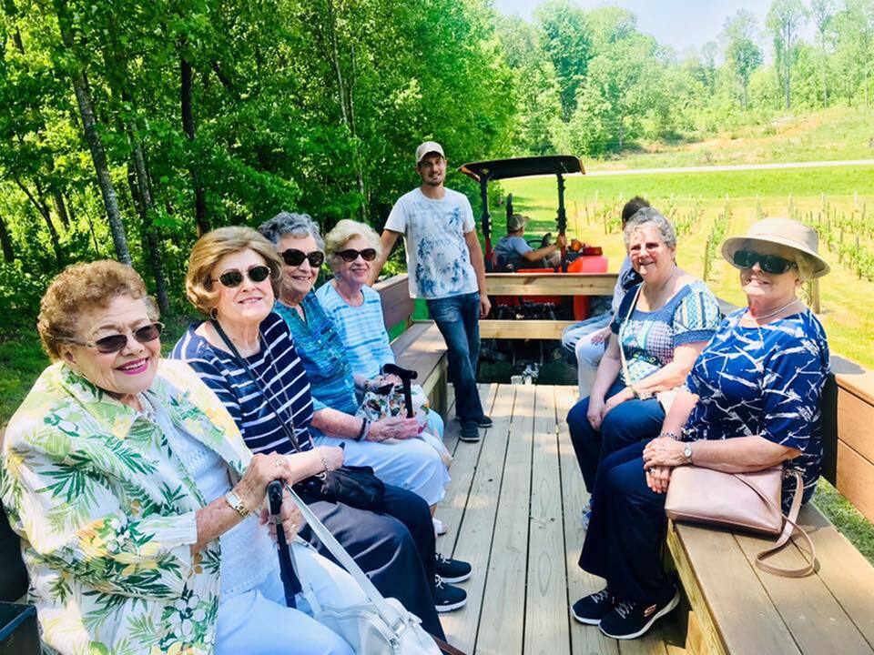 A group of residents enjoying a tractor ride excursion