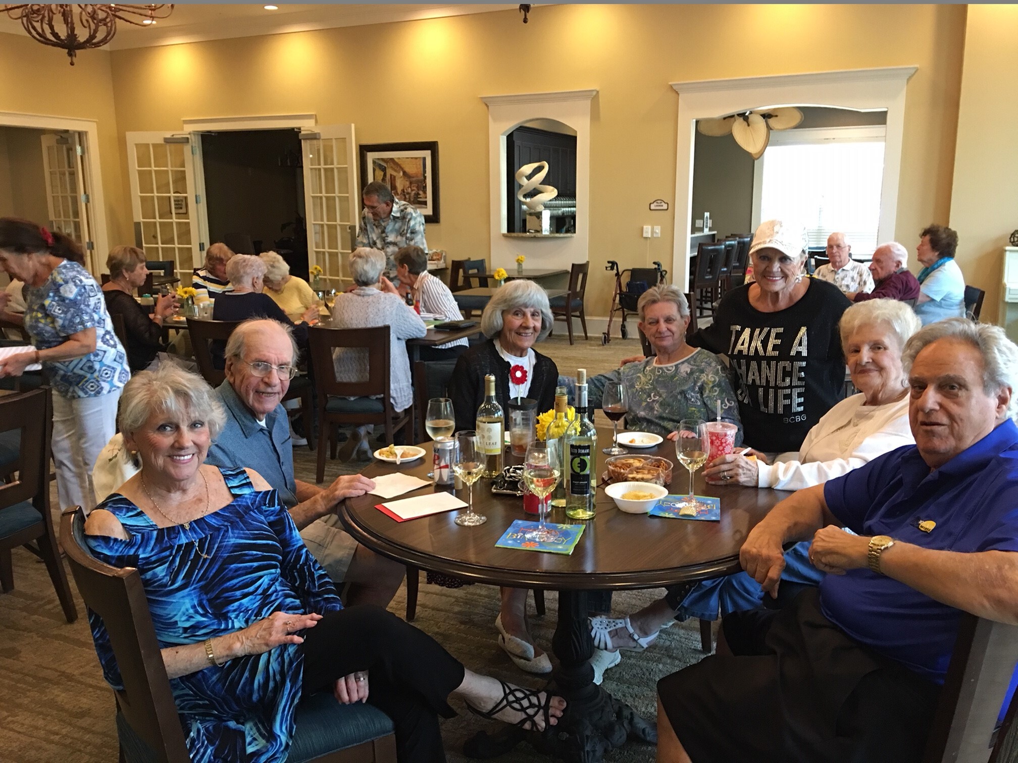 Residents sitting at a table in Sandalwood Village