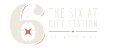 Striking logo of The Six at City Station Luxury Apartments, featuring a bold number 6 with a compass star design exuding elegance and modernity.