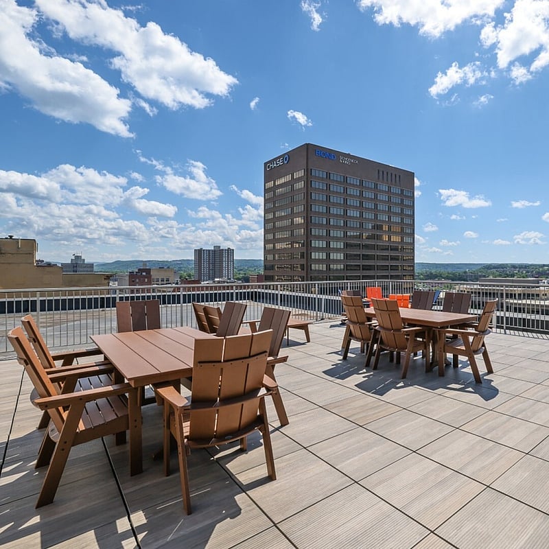 Stunning rooftop terrace with modern seating and panoramic views, perfect for outdoor gatherings and relaxation.