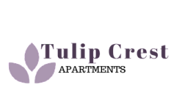 Elegant Tulip Crest logo design featuring a stylish tulip icon in soft mauve tones.