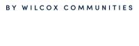 The Thomas by Wilcox Communities logo in elegant dark blue typography on a light background.