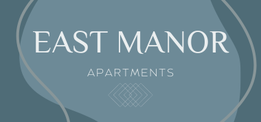 Logo for East Manor Apartments in Springfield, Missouri: the words “EAST MANOR” in large light-gray serif uppercase letters on a muted blue-gray background, with “APARTMENTS” in smaller uppercase below and a geometric diamond-grid i