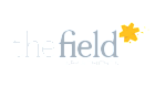 The Field Apartments logo with a bright yellow star accent, conveying a vibrant and welcoming community.
