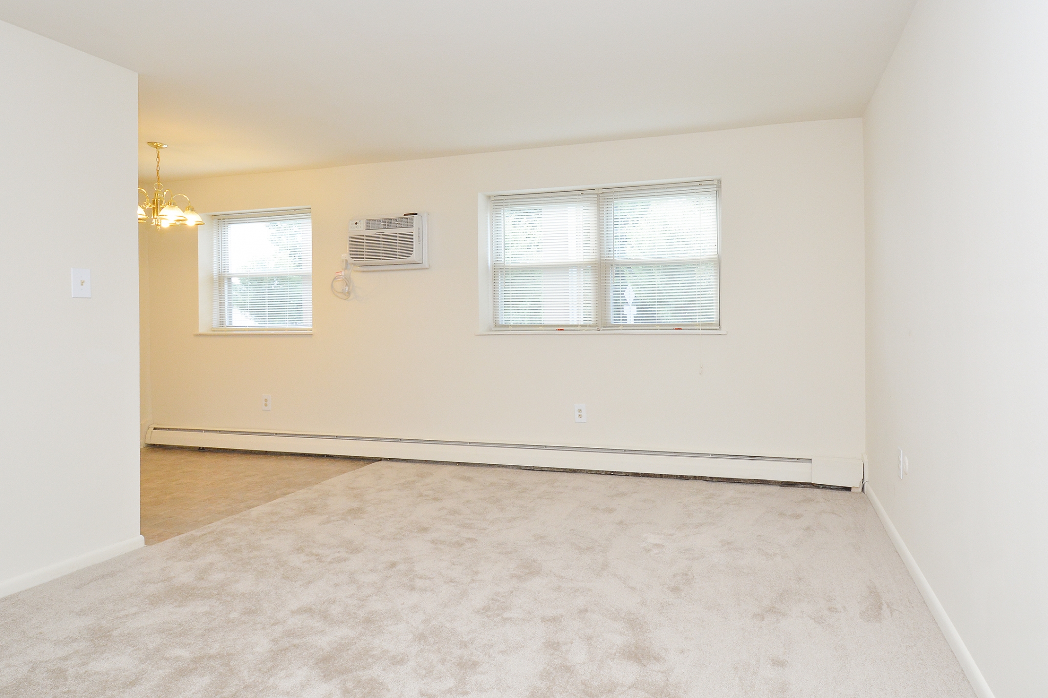 Newport Village Sample Living Room with In-Unit Air Conditioning and Two Windows | Levittown PA Apartments