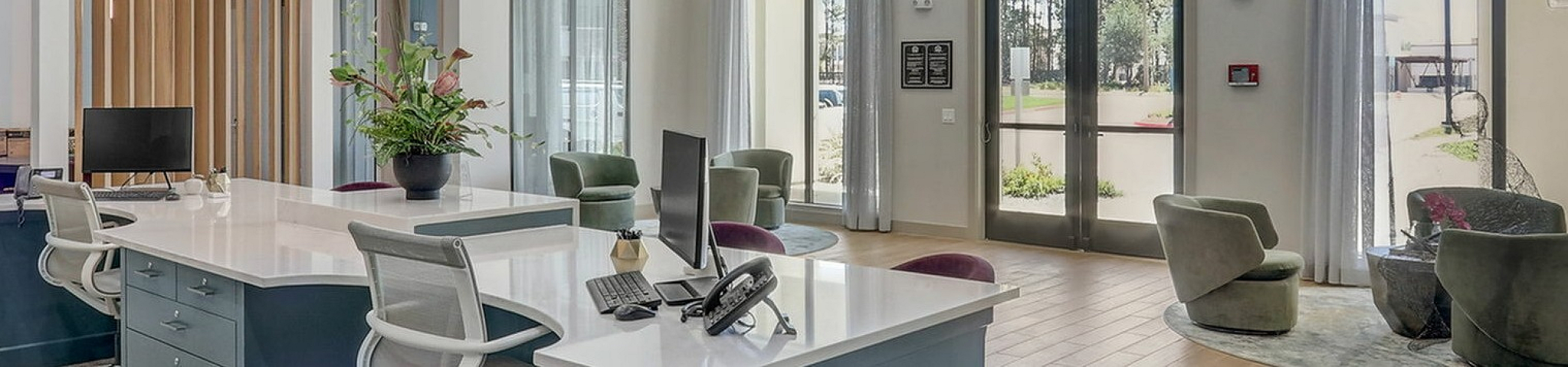 Modern and spacious office interior with elegant design, featuring sleek workstations, stylish seating area, and abundant natural light.
