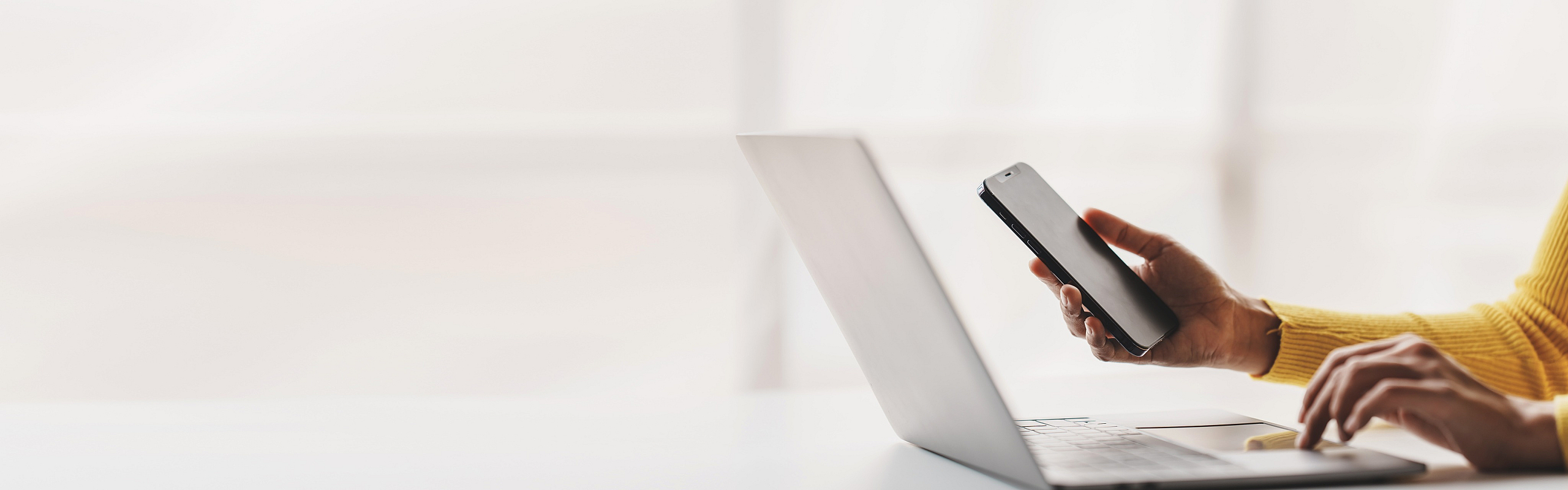person with laptop and phone