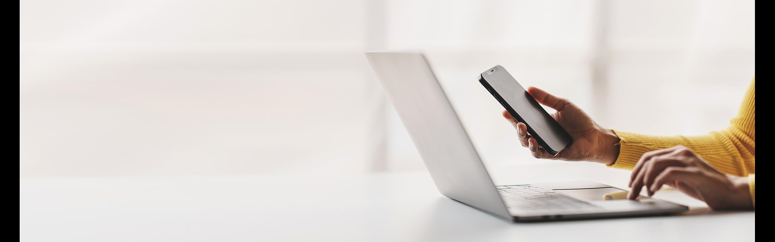 person with laptop and phone