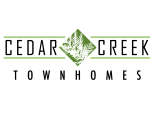 Elegant green logo featuring a stylized, nature-inspired design with symmetrical lines and intricate foliage.