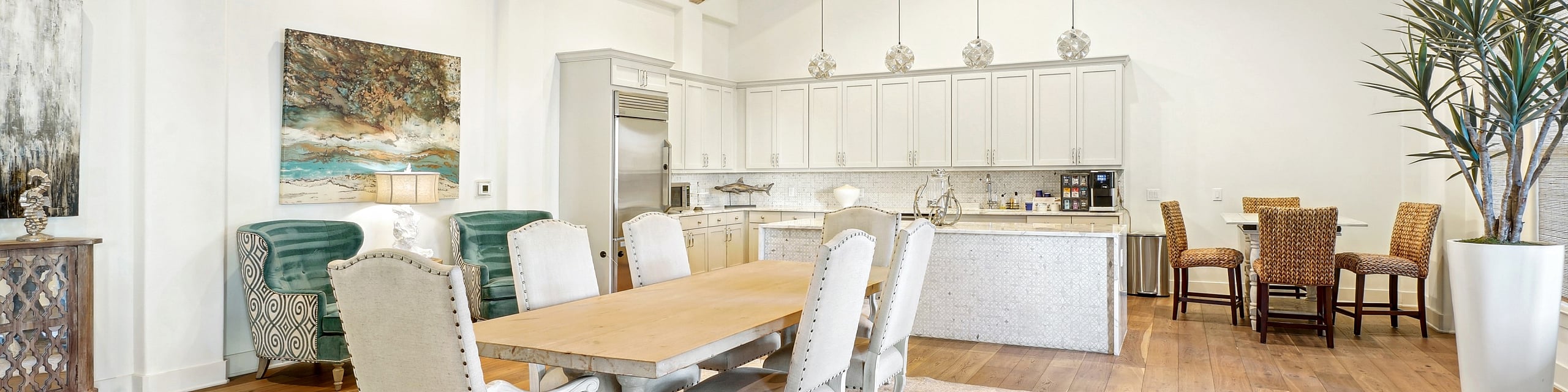 Elegant open-concept dining area with rustic high ceilings, modern kitchen, and exquisite decor, ideal for stylish entertaining.